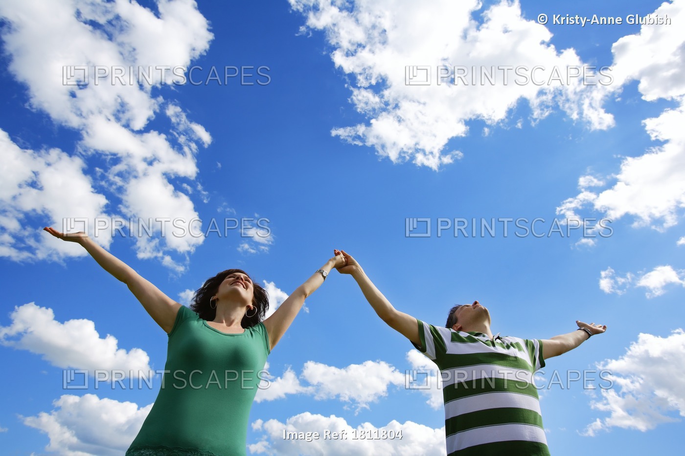 Couple With Arms Outstretched