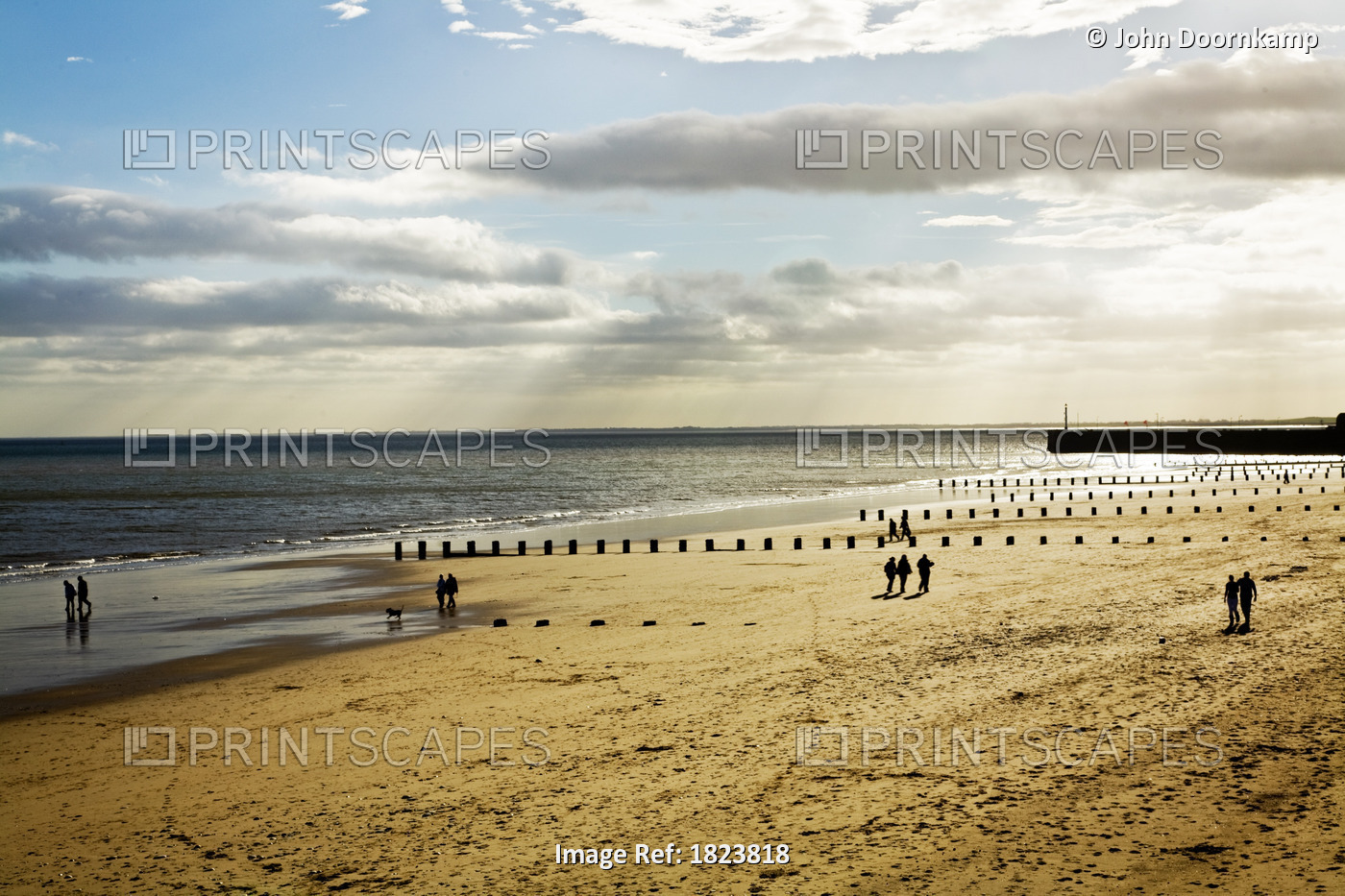 PEOPLE ON A BEACH, BRIDLINGTON, ENGLAND