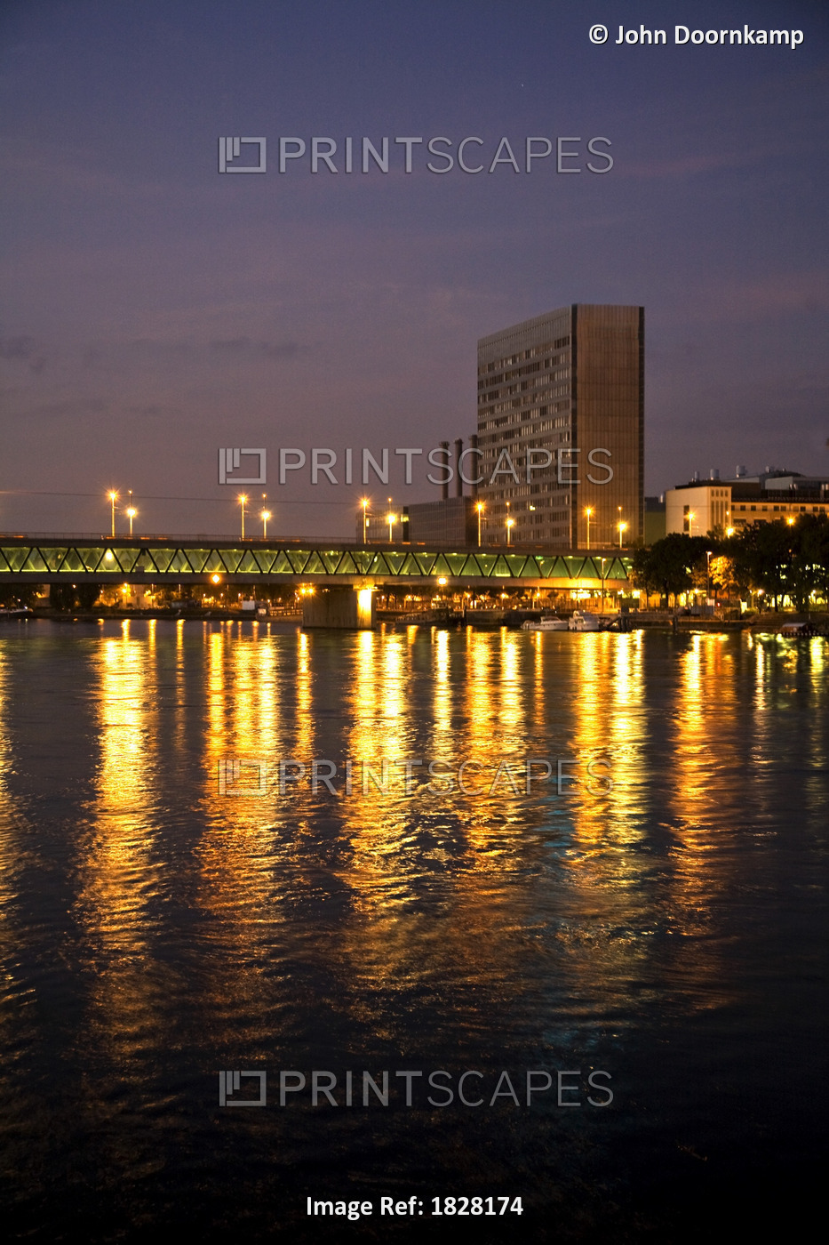 BUILDINGS AND CITY LIGHTS REFLECTED IN THE RIVER RHINE, GERMANY