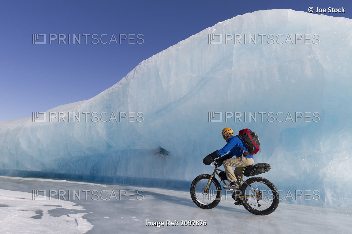 Man Fat Tire Mountain Biking On Ice At The Knik Glacier, Chugach Mountains, ...