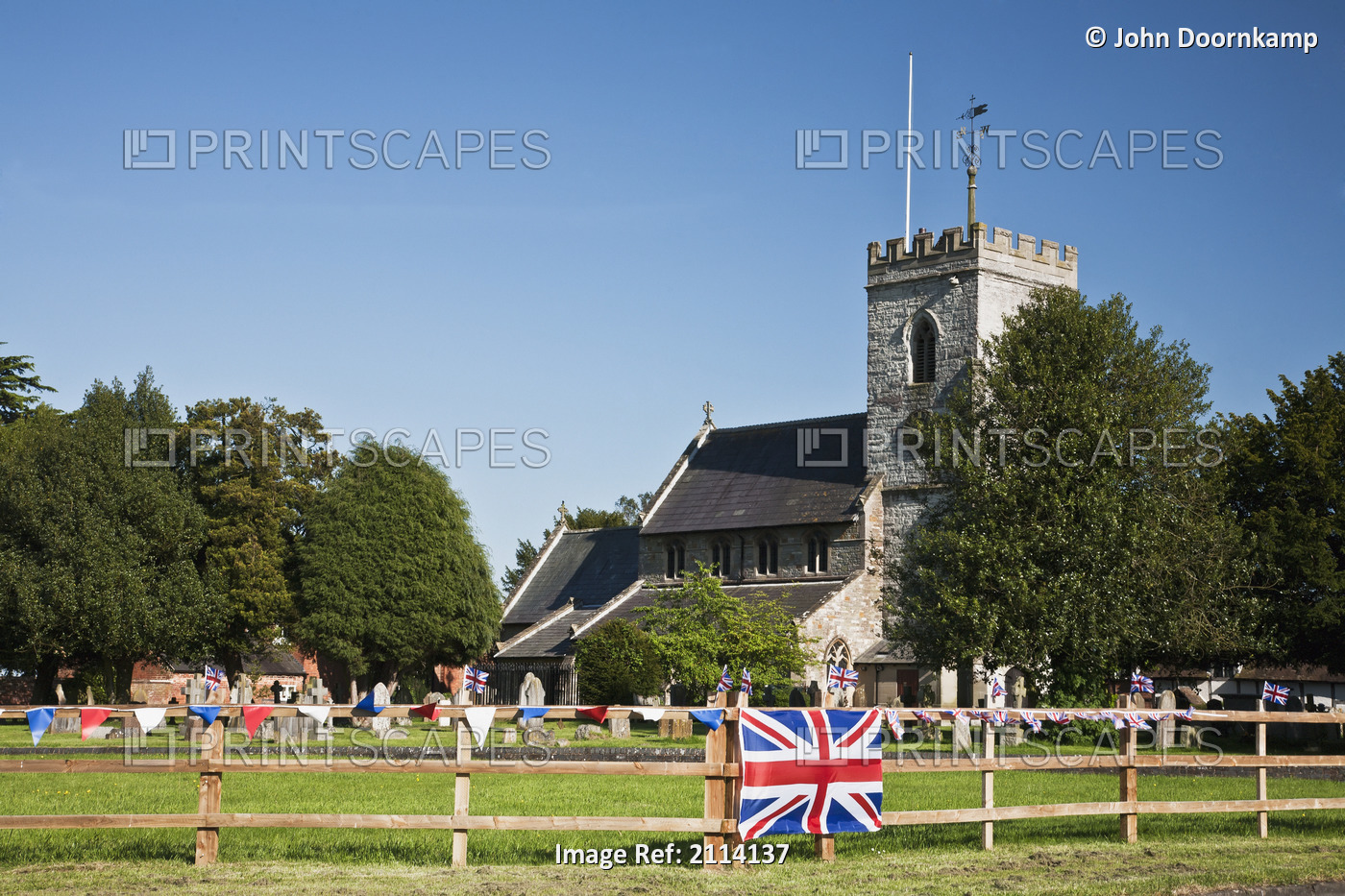 English Village Church And Flag On A Fence; Claverdon Warwickshire England
