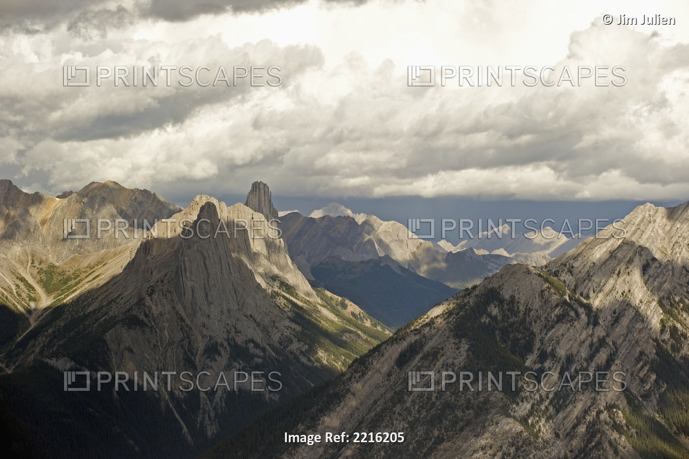 Cloud over rugged mountain peaks;Banff alberta canada