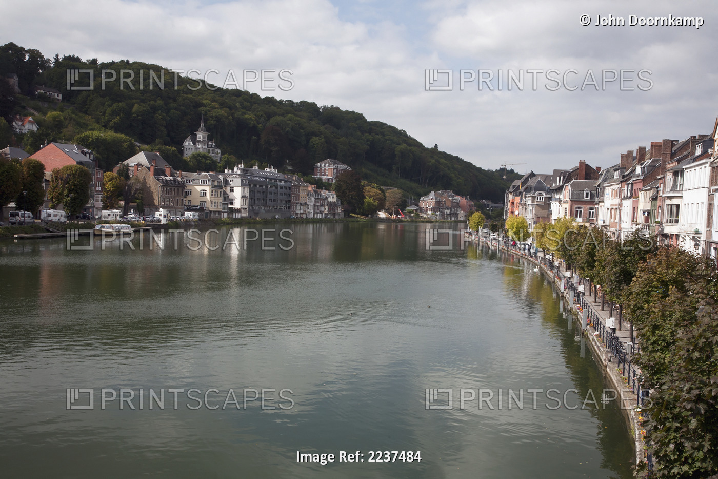 Buildings And Pedestrians Along The River Meuse; Dinant, Namur, Belgium