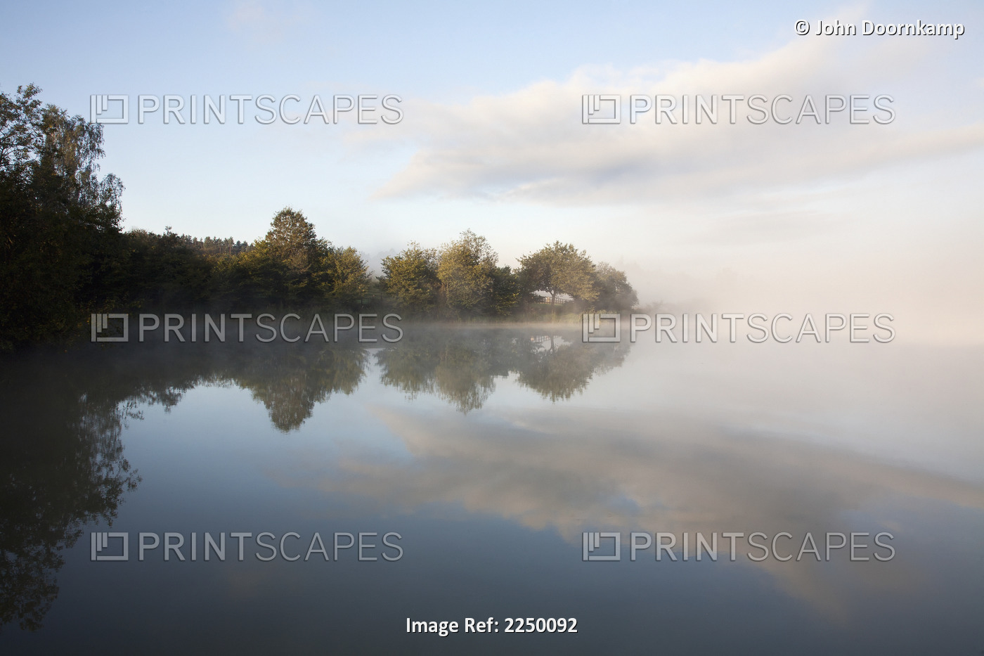Mist over a tranquil lake; Moulin de Boiron, Gedinne, Belgium