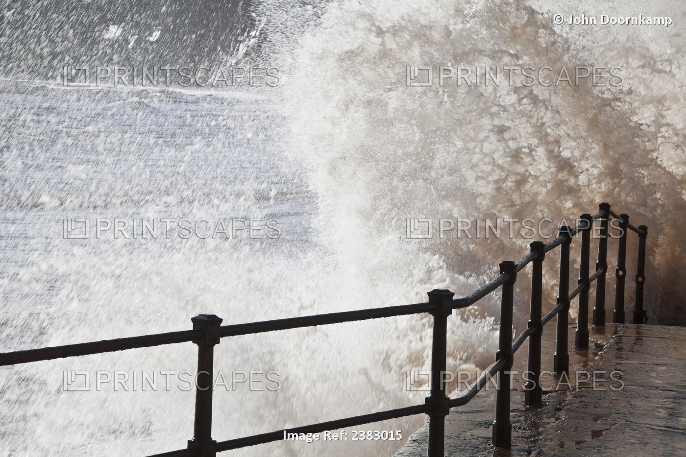 Waves crashing against the sea wall, Sidmouth, England