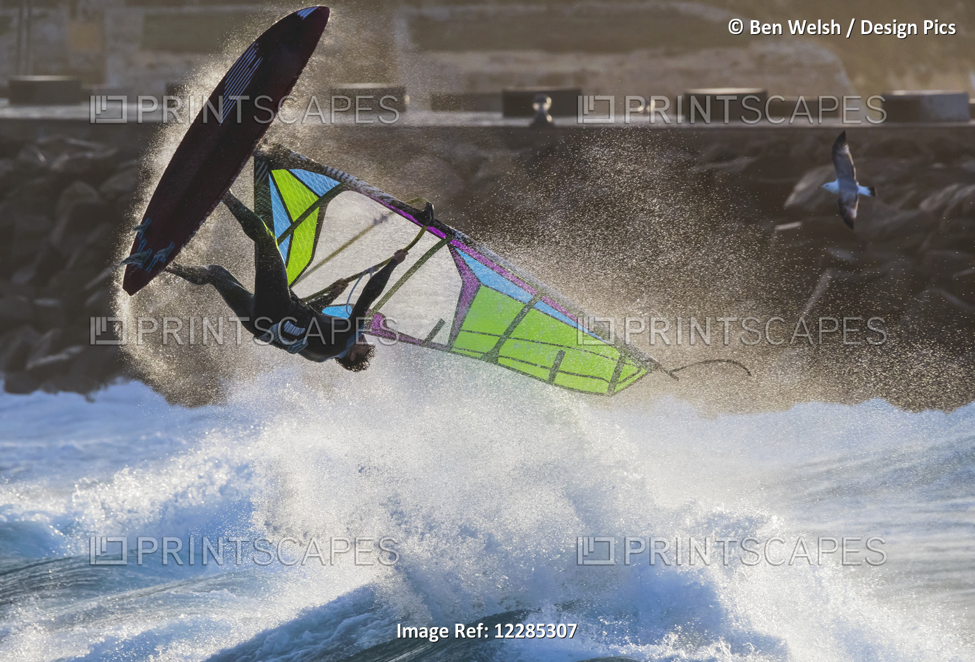Windsurfer Flipping Upside Down Over The Water; Tarifa, Cadiz, Andalusia, Spain