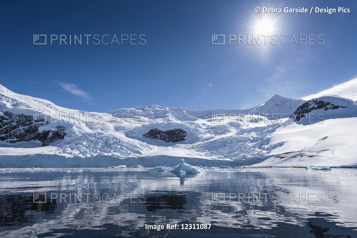 Bright Sun And Snow On The Mountains Reflected In The Water Of Neko Harbour; ...