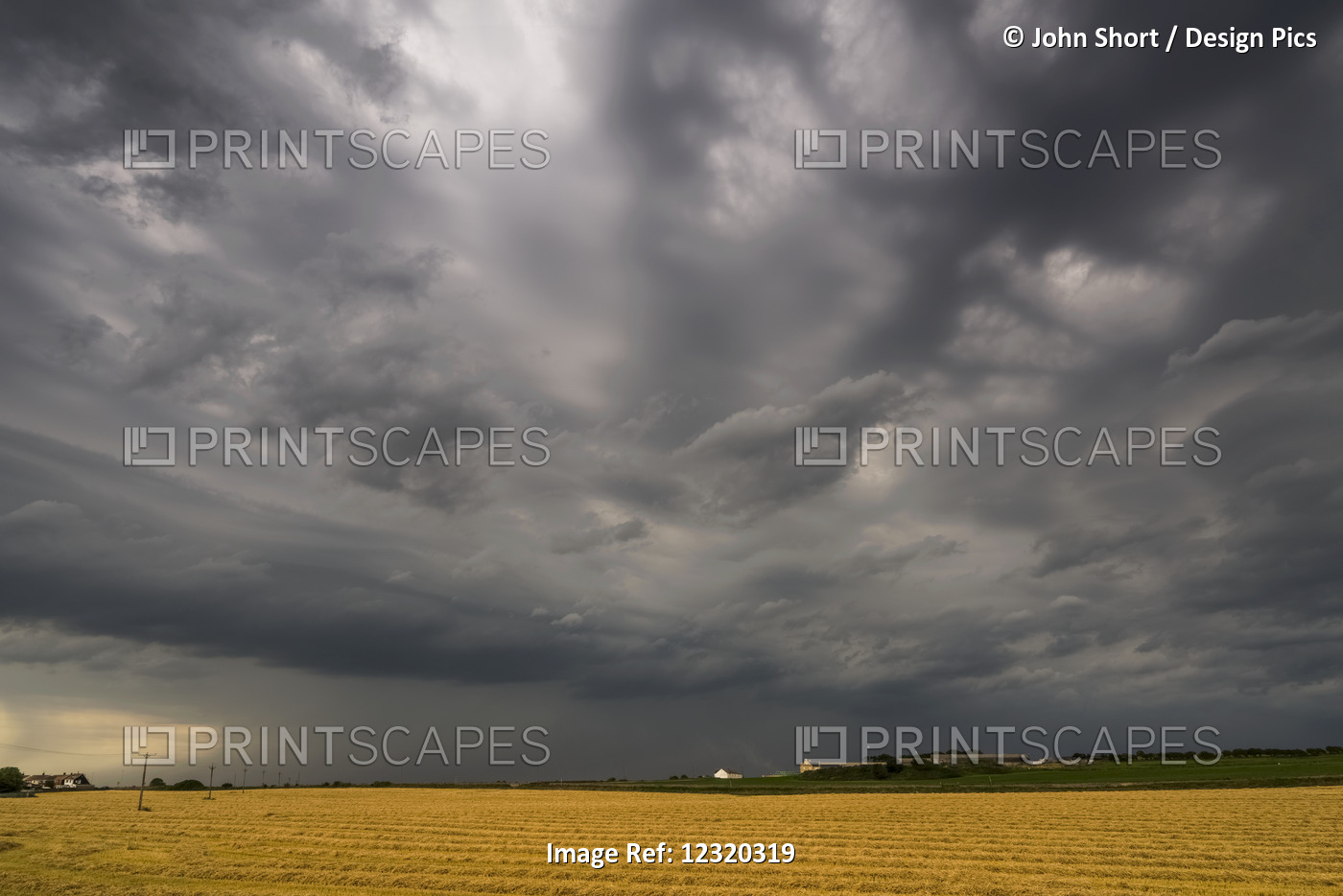 Dark Storm Clouds Over A Farm Field; Whitburn, Tyne And Wear, England