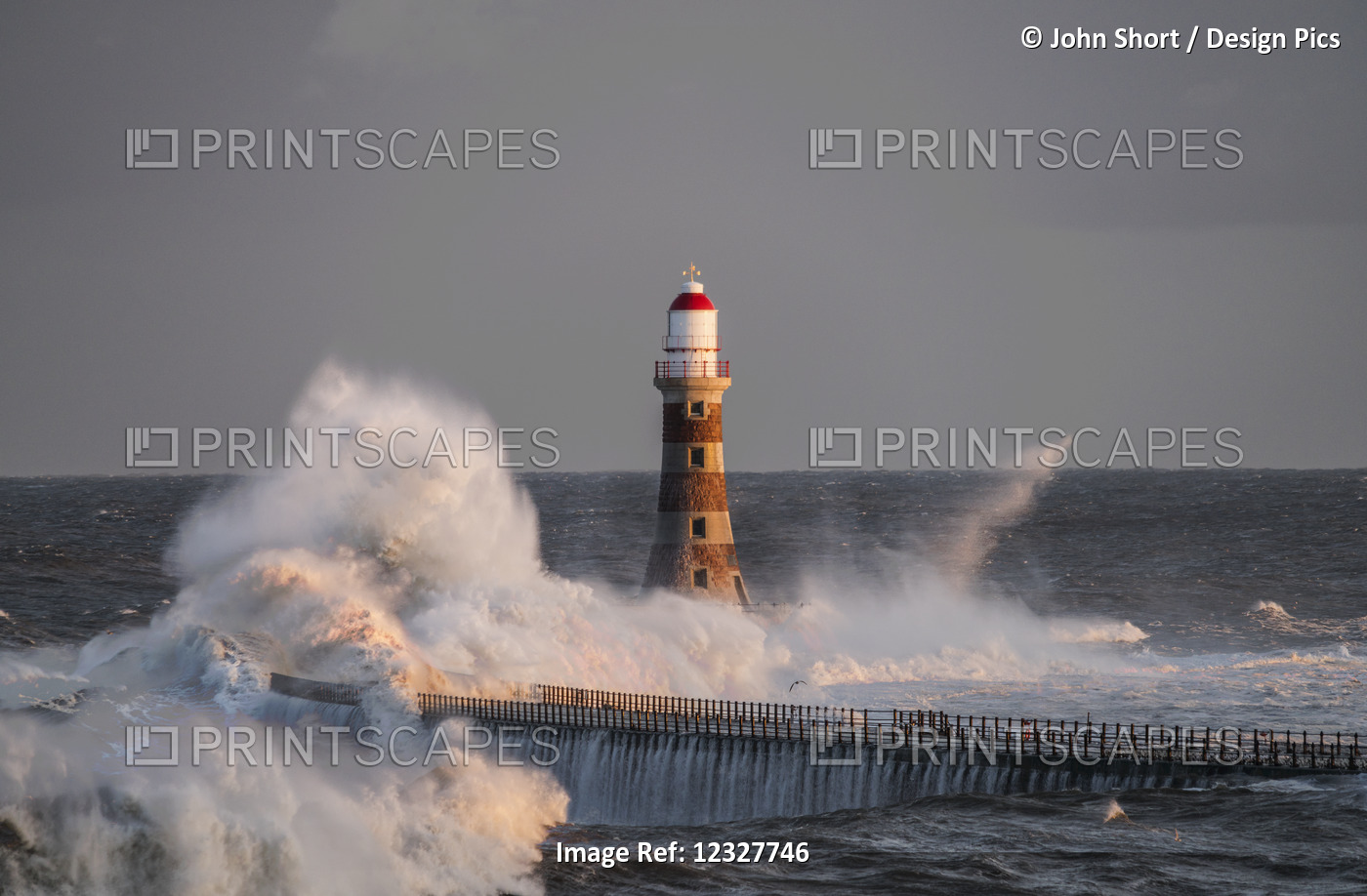 Waves Splashing Against Roker Lighthouse At The End Of A Pier; Sunderland, Tyne ...