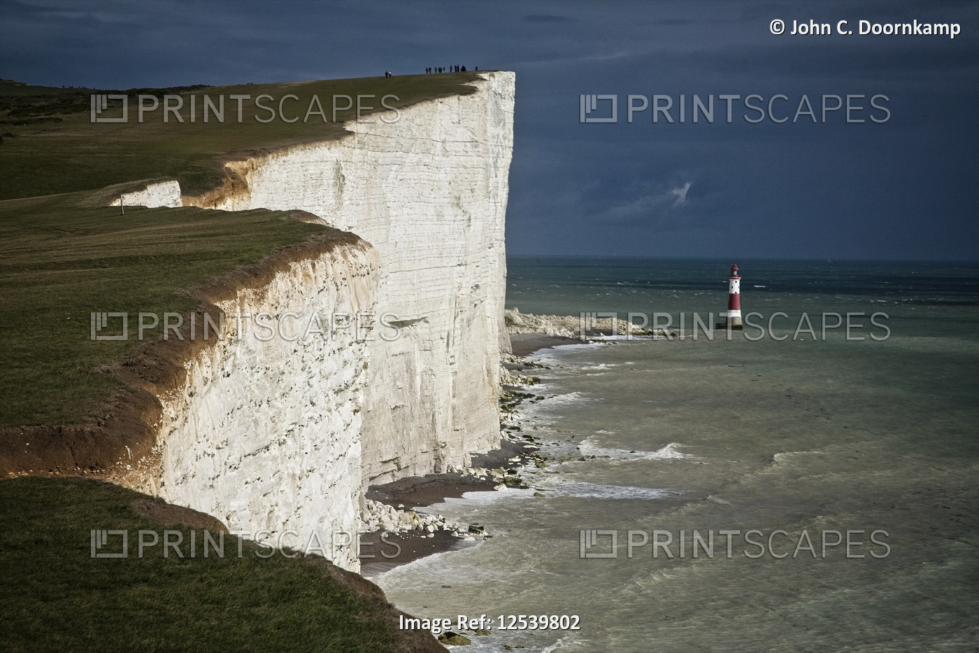 THE LIGHTHOUSE BELOW THE CLIFFS AT BEACHY HEAD, EASTBOURNE, SUSSEX, ENGLAND
