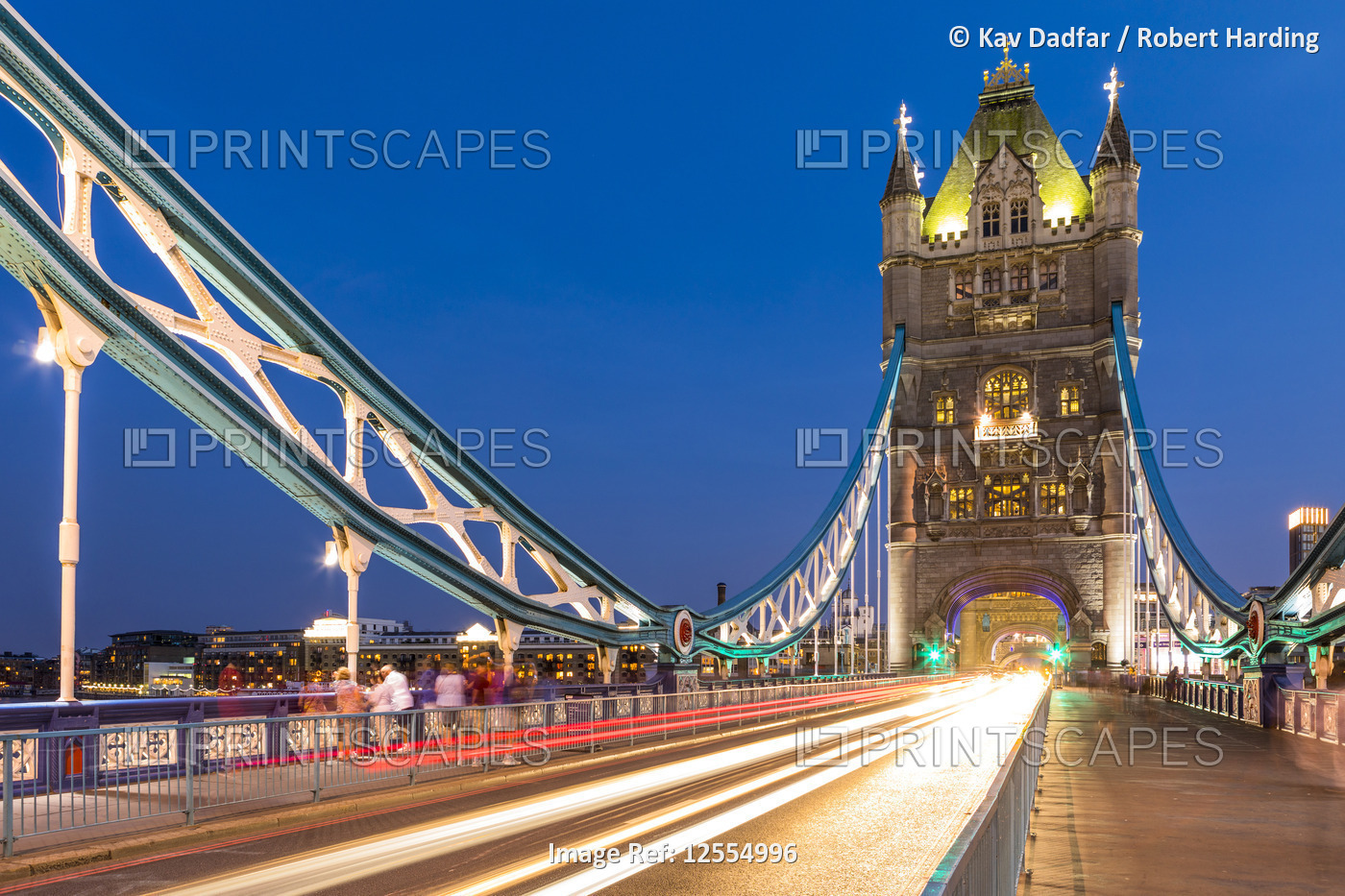 Traffic driving over Tower Bridge in early evening light, London, England, United Kingdom, Europe