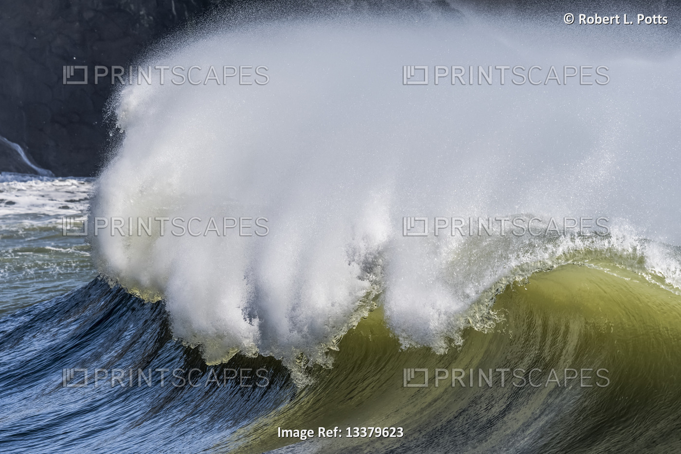 Spray blows from the crest of a wave; Ilwaco, Washington, United States of ...