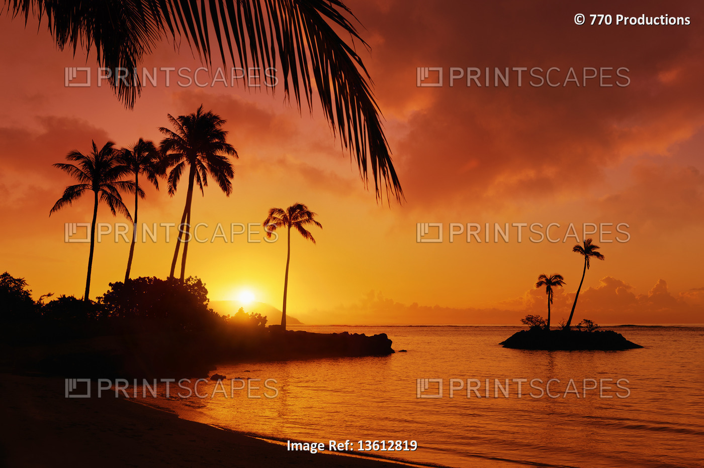 Sunrise at Kahala Beach, Waiʻalae Beach Park, with the sun in a glowing red sky ...