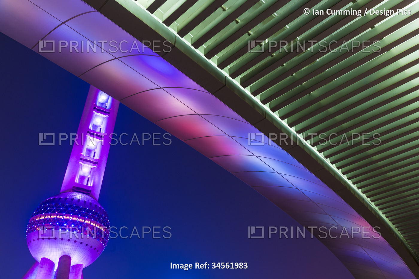 Detail of a pedestrian overpass and the Oriental Pearl Tower at dusk in ...